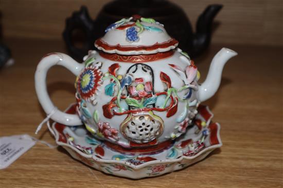 An 18th century Chinese Export famille rose teapot, cover and a similar dish